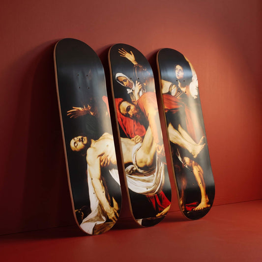 Entombment of Christ 3 deck skateboard wall art leaning against a crimson wall