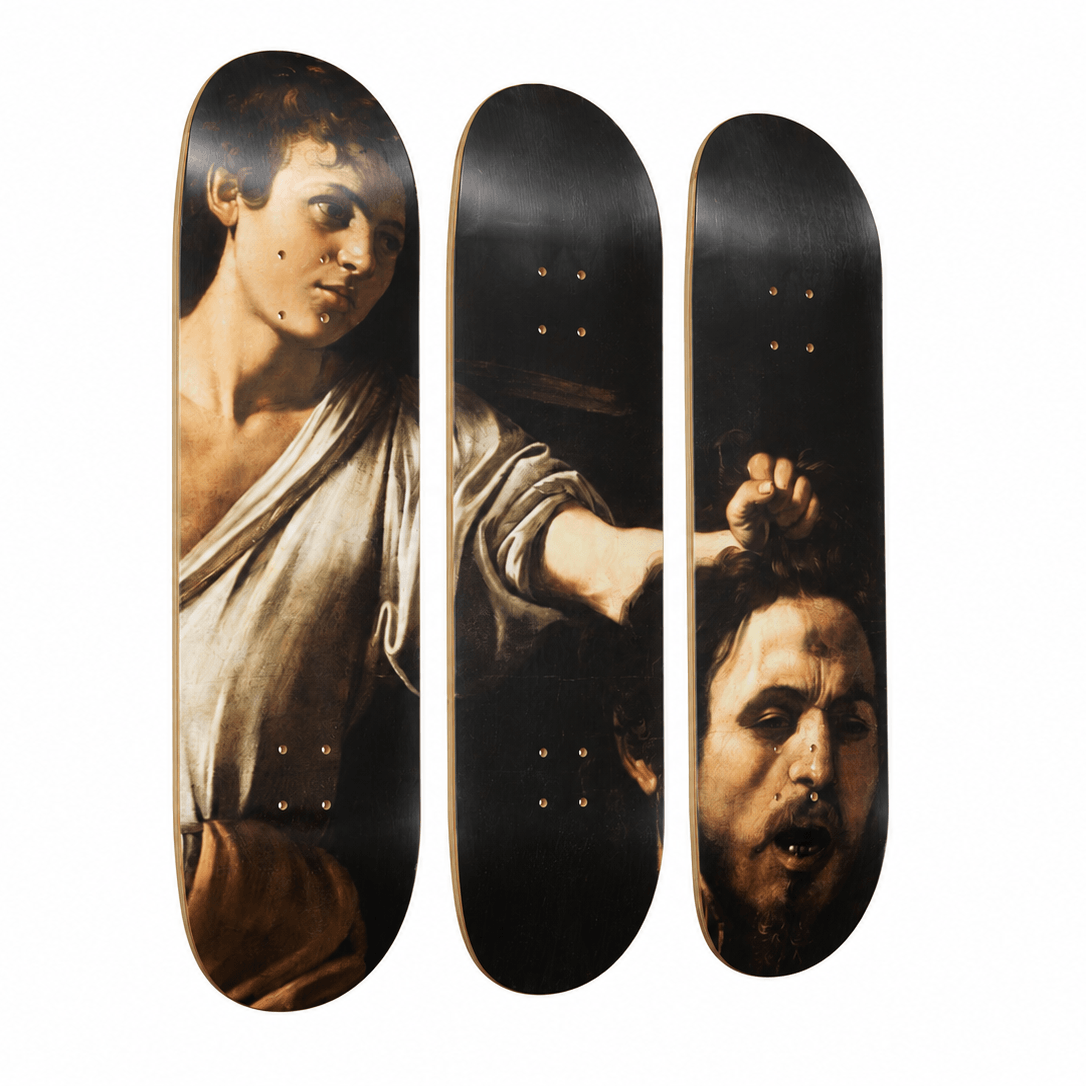Three skateboard deck edges arranged vertically side by side, featuring a dramatic classical painting print of a bearded man's face and draped clothing in warm brown, beige, and black tones.