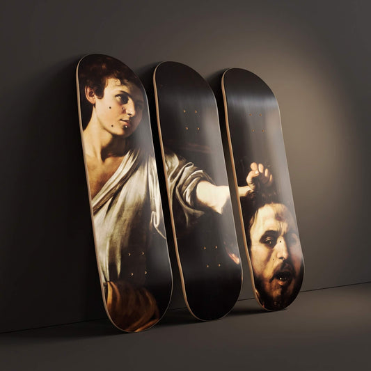 David With the Head of Goliath 3 deck skateboard wall art leaning against a charcoal wall