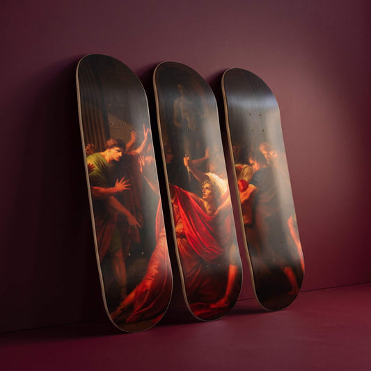 The Assassination of Julius Caesar 3 deck skateboard wall art leaning against a deep wine wall