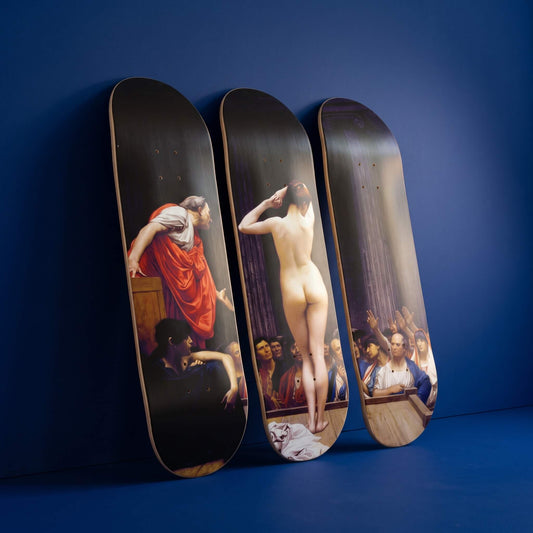 Roman Slave Market 3 deck skateboard wall art leaning against a cobalt blue wall