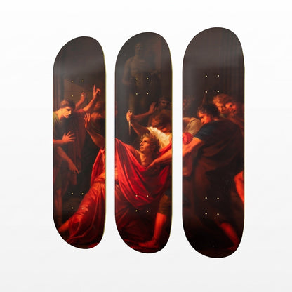 Three skateboard deck edges arranged vertically side by side, featuring a classical painting print with warm red drapery and dark shadowy figures, on a plain white background.