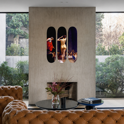 A modern living room interior with tufted brown leather armchairs, a round black coffee table, and a central beige wall featuring three vertical dark panels displaying colorful artwork of figures. Large windows with black frames look out onto greenery.
